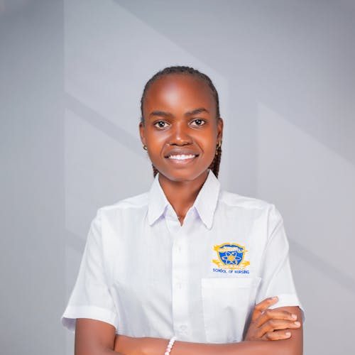 Portrait of a young woman in school uniform with a confident expression, indoors.